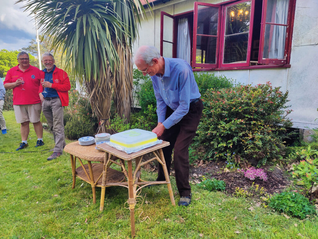 Richard cutting his cake on his signifcant birthday. 